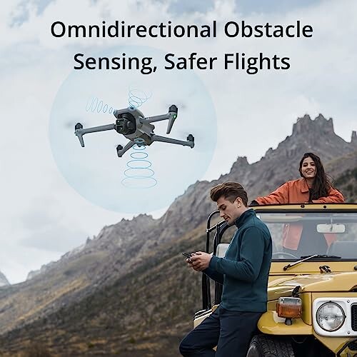 Drone with obstacle sensing technology flying near mountains with people and jeep.