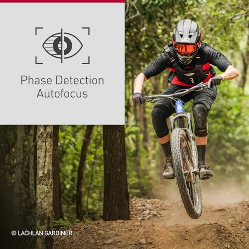 Mountain biker in action on forest trail with phase detection autofocus feature.